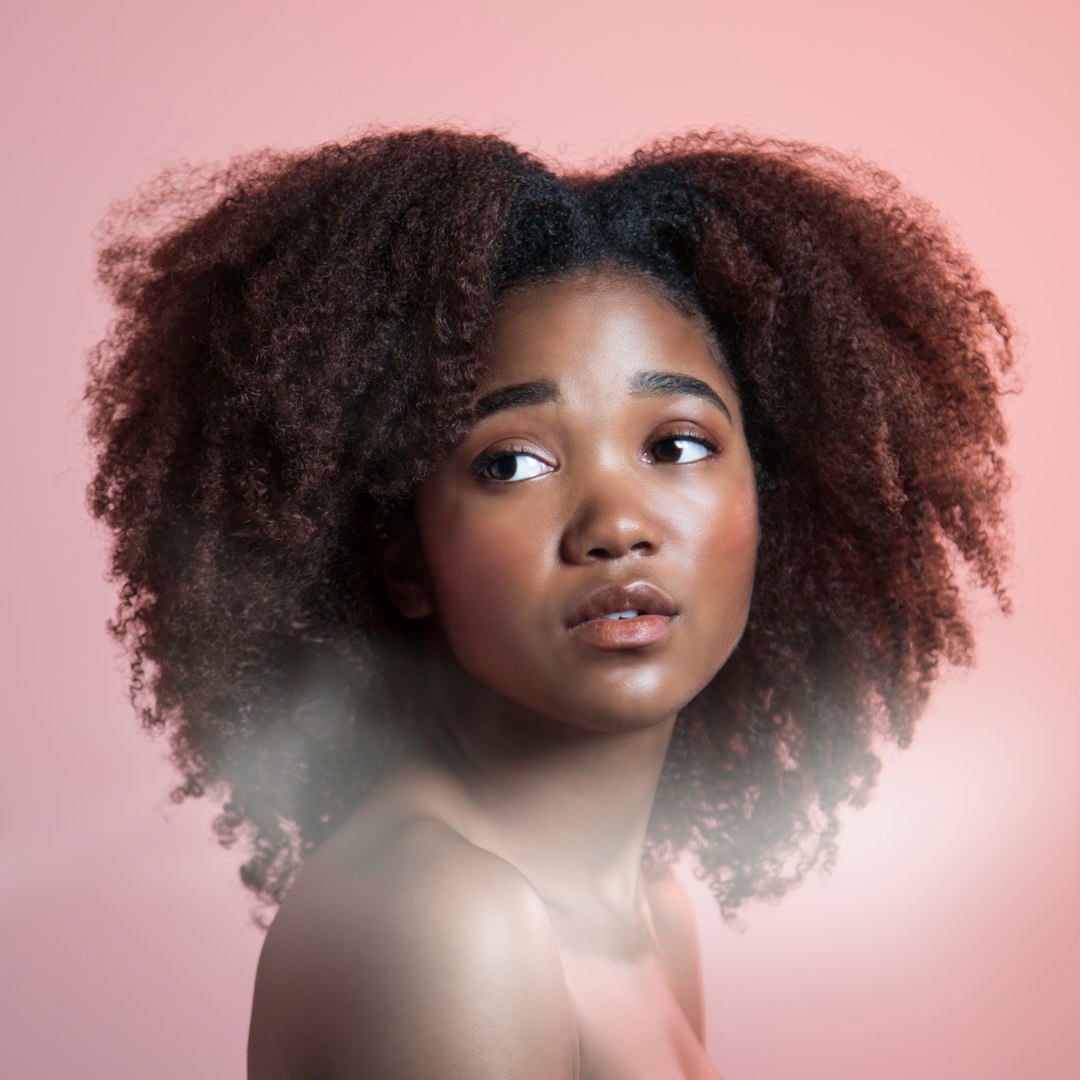This series shows the beauty of each model. The point was to make them look super cute.- jekafe
Model's IG: dnakeys by Walkathon Benefits a woman with an afro is looking at the camera