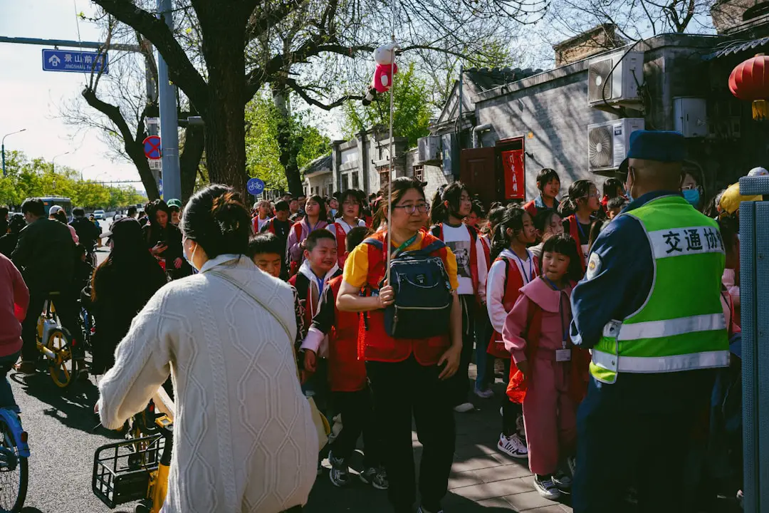 a group of people walking down a street